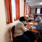 Older people enjoy various activities at the Day Centre including written quizes for mental stimulation to improve memory