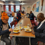 Older people are enjoying their meal. Bon appetite!