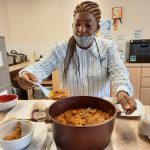 Staff serving Ghanaian delicious "Banku dish with Okra stew"
