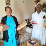 Older people receiving, their presents from SAWÑ